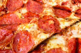 pepperoni pizza on white ceramic plate