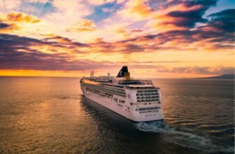 white cruise ship under cloudy sky