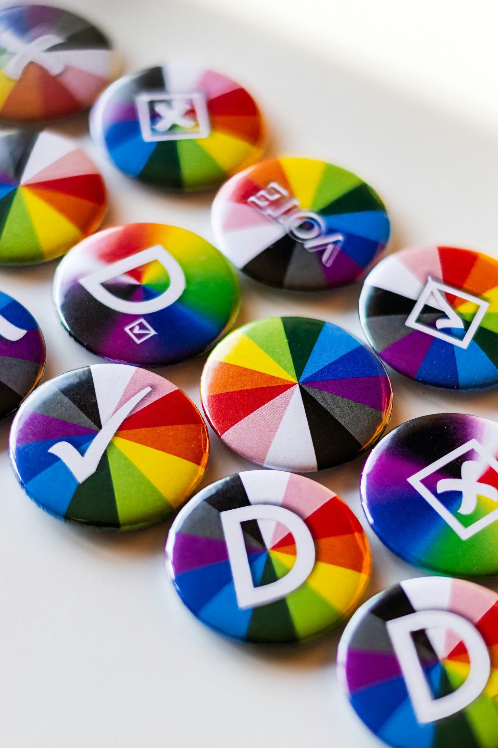 A bunch of colorful buttons sitting on top of a table