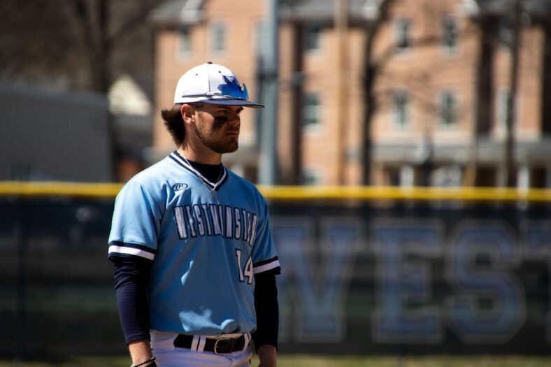 man in blue and white nike jersey shirt wearing blue and white baseball helmet