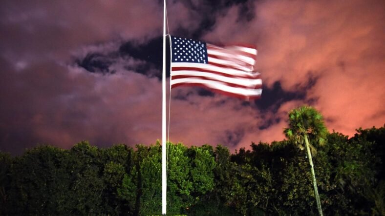 Why are US and state flags in Florida at half-staff today?
