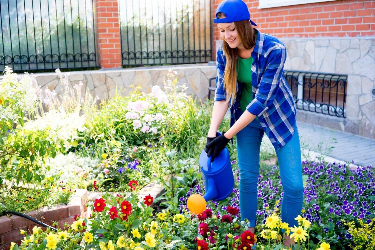 2725398-woman-working-garden.jpg Woman Quoted $131K for Garden Makeover—She Does It Hersel…