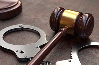 83703 gavel and handcuffs on wooden table background 81852af5.png