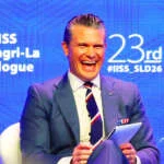 Hegseth tones down China warning at defense forum