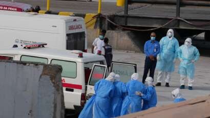 Edc381 20260509 health workers in protective gear evacuating patients 2000.jpg