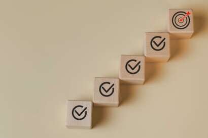 Goal achievement and business success concept with step by step checklist leading to target.jpg