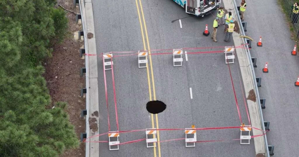Large sinkhole blocks traffic on Yonkers Road in Raleigh :: WRAL.com