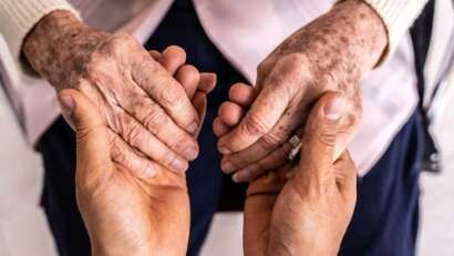 Person holding senior hands longevity.jpg